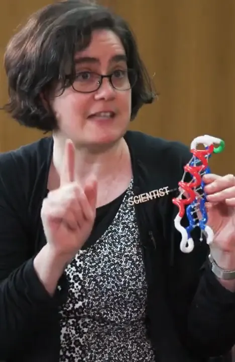 Dr. Sarah Bowman holding up a model of a protein, from Nerdy Jobs Episode 1