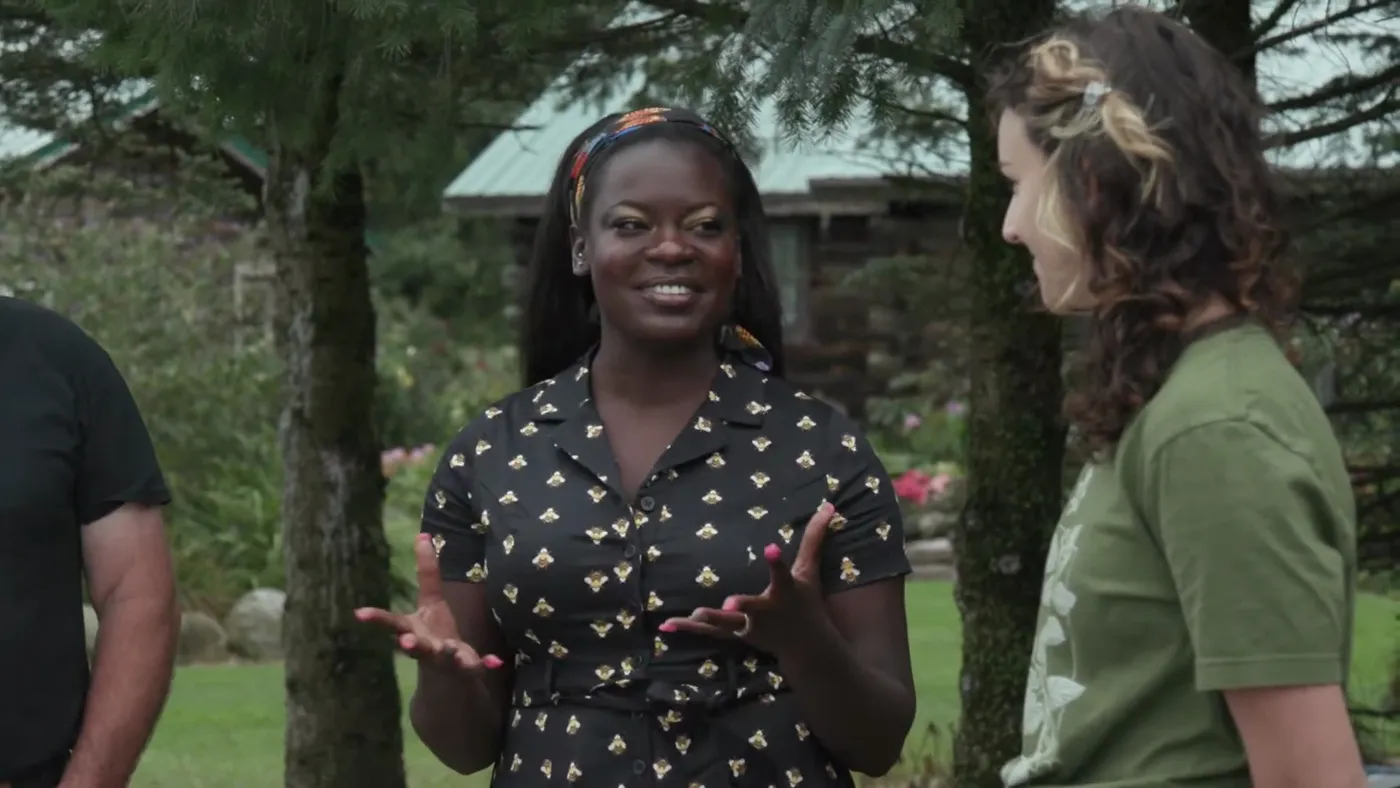 Dr. Raven Baxter laughing outdoors among the trees, from Nerdy Jobs Episode 2