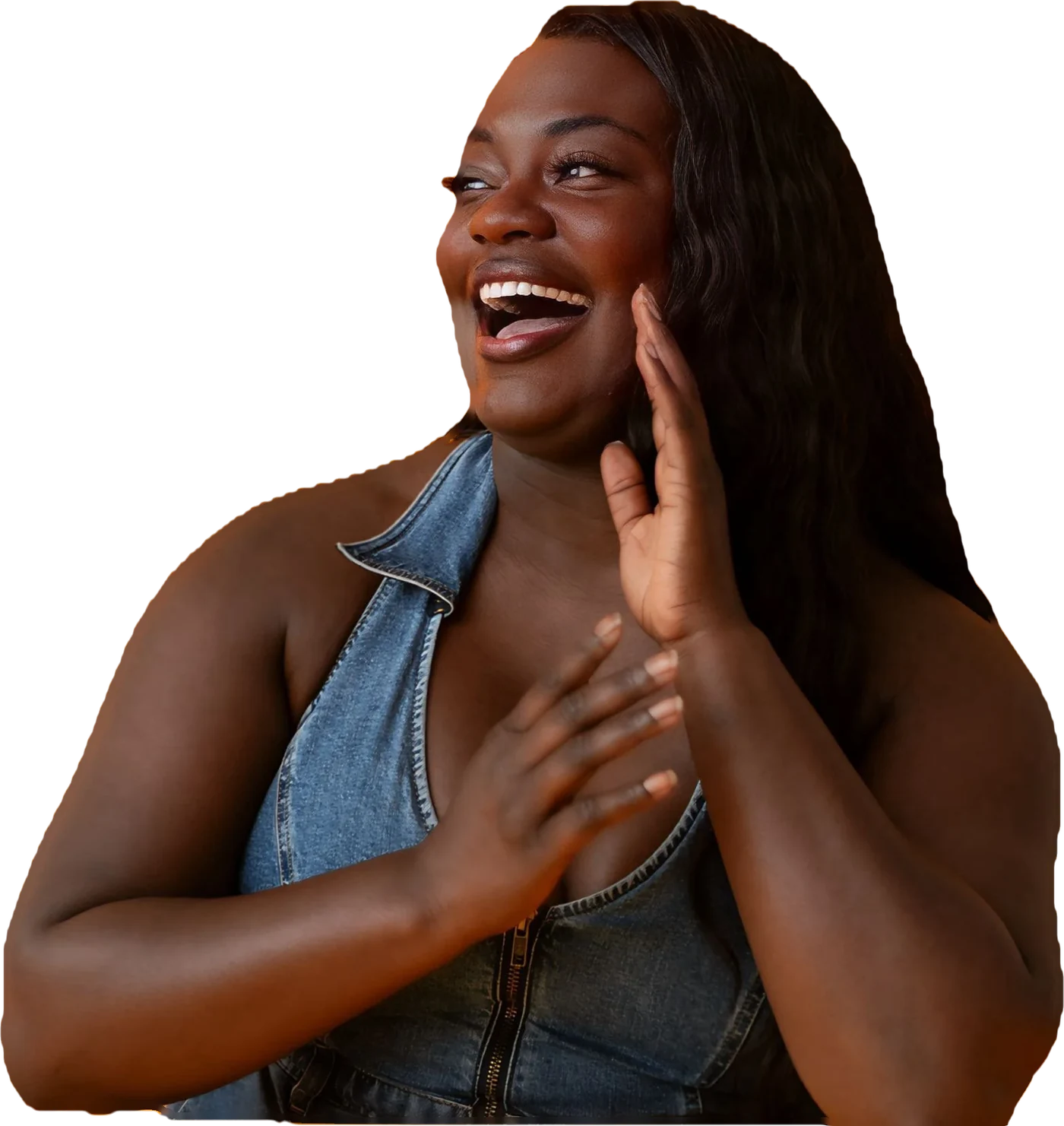 Dr. Raven Baxter smiling in a denim jumpsuit